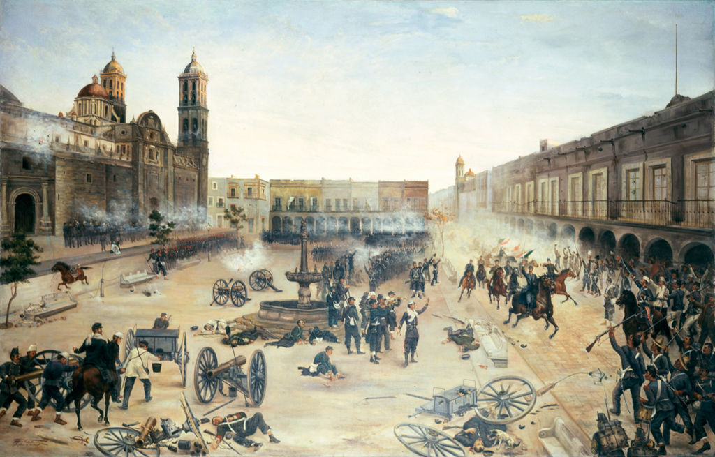 Entrada de la caballería republicana comandada por Porfirio Díaz a la ciudad de Puebla, el 2 de abril de 1867. Pintura realizada por el artista mexicano Francisco de Paula Mendoza en 1902.