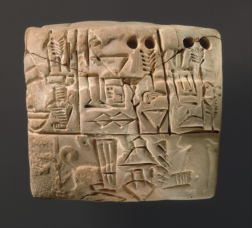 Tablilla con inscripciones proto-cuneiformes (ca. 3100-2900 a.C.). En este documento administrativo se puede observar el registro que un escriba sumerio realizó acerca de una distribución de cebada