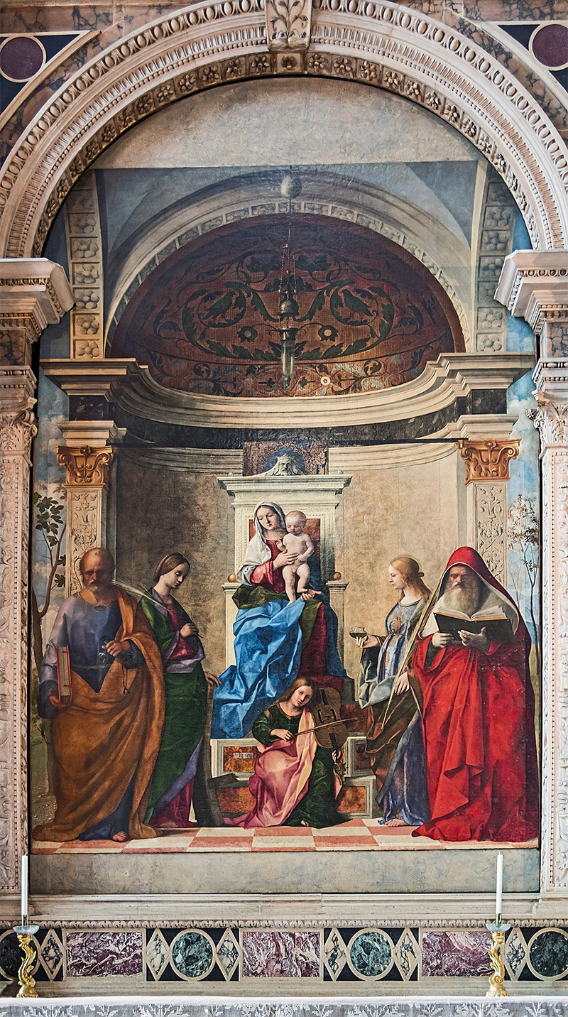 Giovanni Bellini, Palla di San Zaccaria, 1505, Venecia. Los personajes parecen estar ocupando un espacio arquitectónico real que repite los recursos visuales de la iglesia donde se encuentra la pintura.
